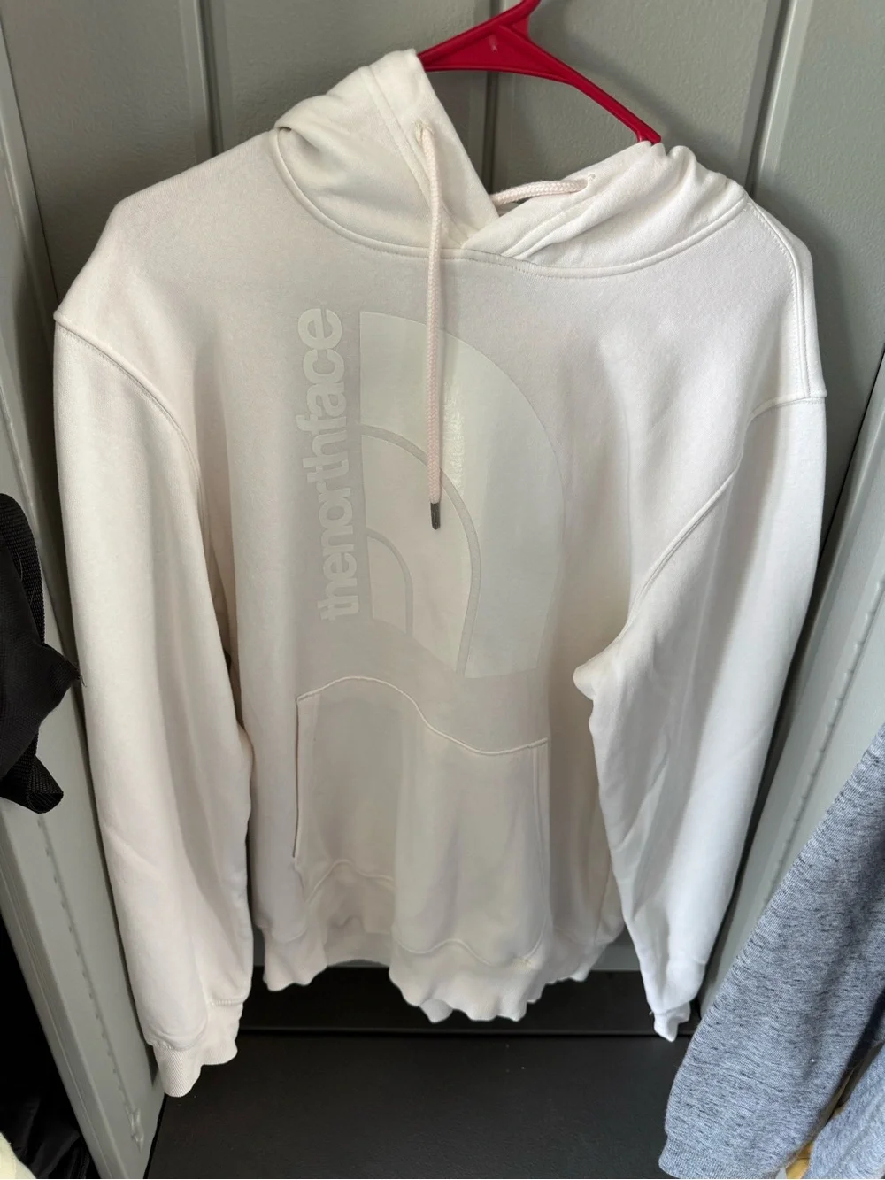 The North Face Cream Pullover Hoodie with Subtle Logo